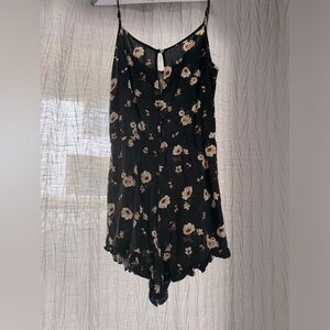 S, Daisies floral and black romper with adjustable shoulder straps.